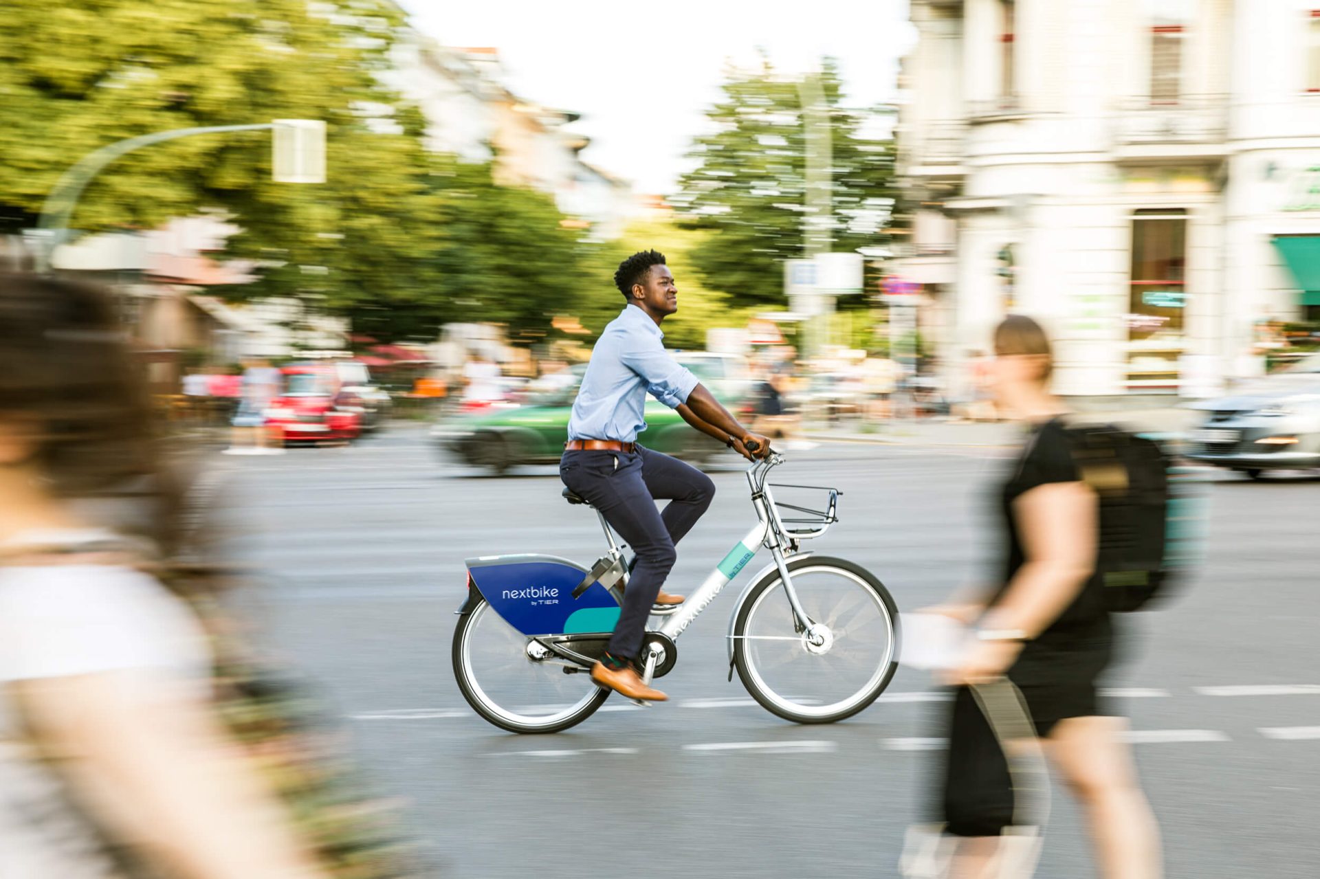 Man drives nextbike on the street